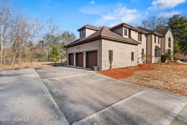 a dining room with furniture and mirror