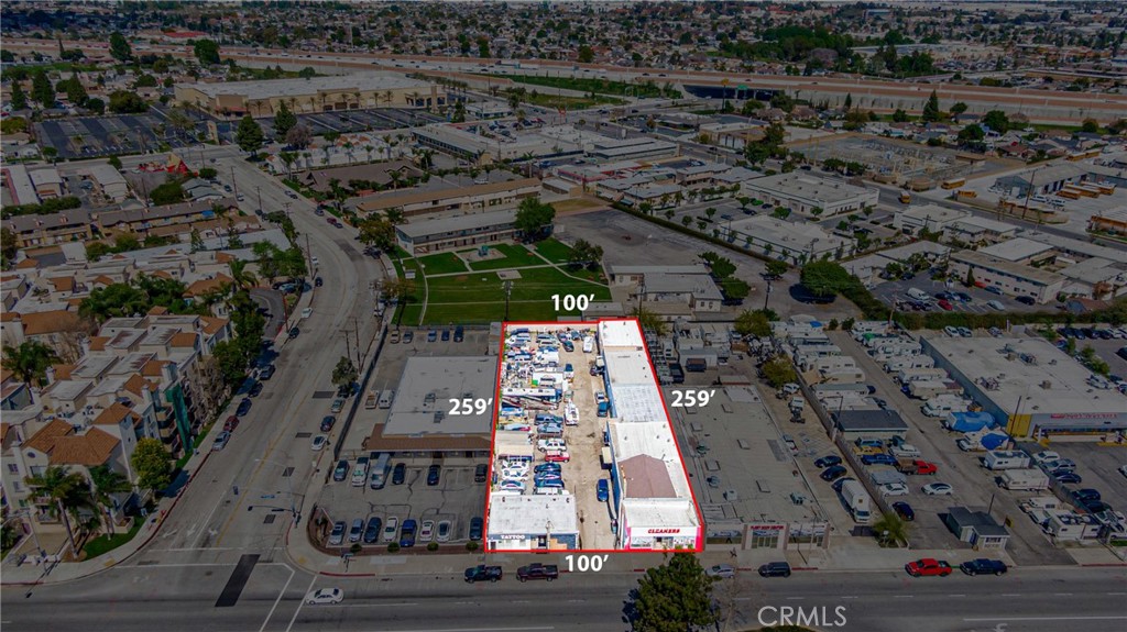 11669 Firestone Boulevard Norwalk, CA 90650 - Photo 12 of 23 an aerial view of multi story residential apartment building with parking area
