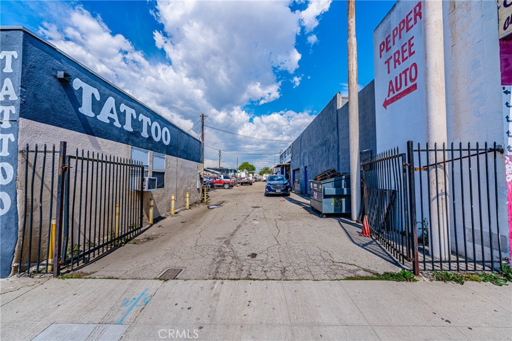 11669 Firestone Boulevard Norwalk, CA 90650 - Photo 4 of 23 a view of pathway along with building