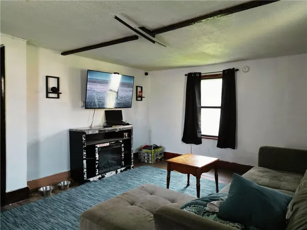 a livingroom with furniture and a window