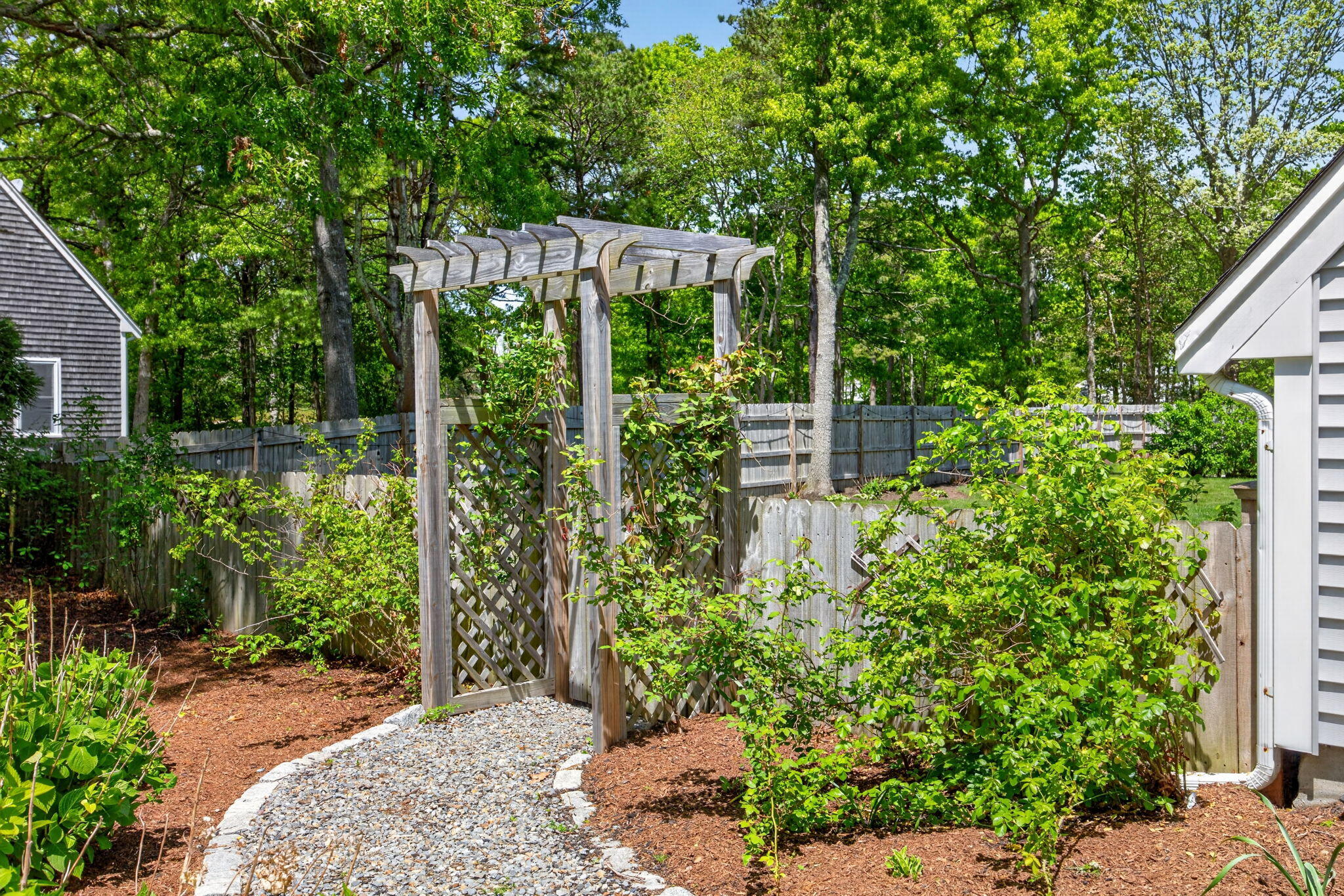 12 Sarah Lawrence Road Sandwich, MA 02563 - Photo 49 of 54 a backyard of a house with lots of green space