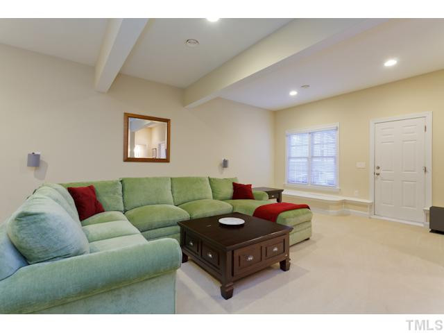 7613 Double E Court Raleigh, NC 27613 - Photo 11 of 23 Finished Basement is perfect for media or play space. Easy access to the Pool & Patio! Basement
