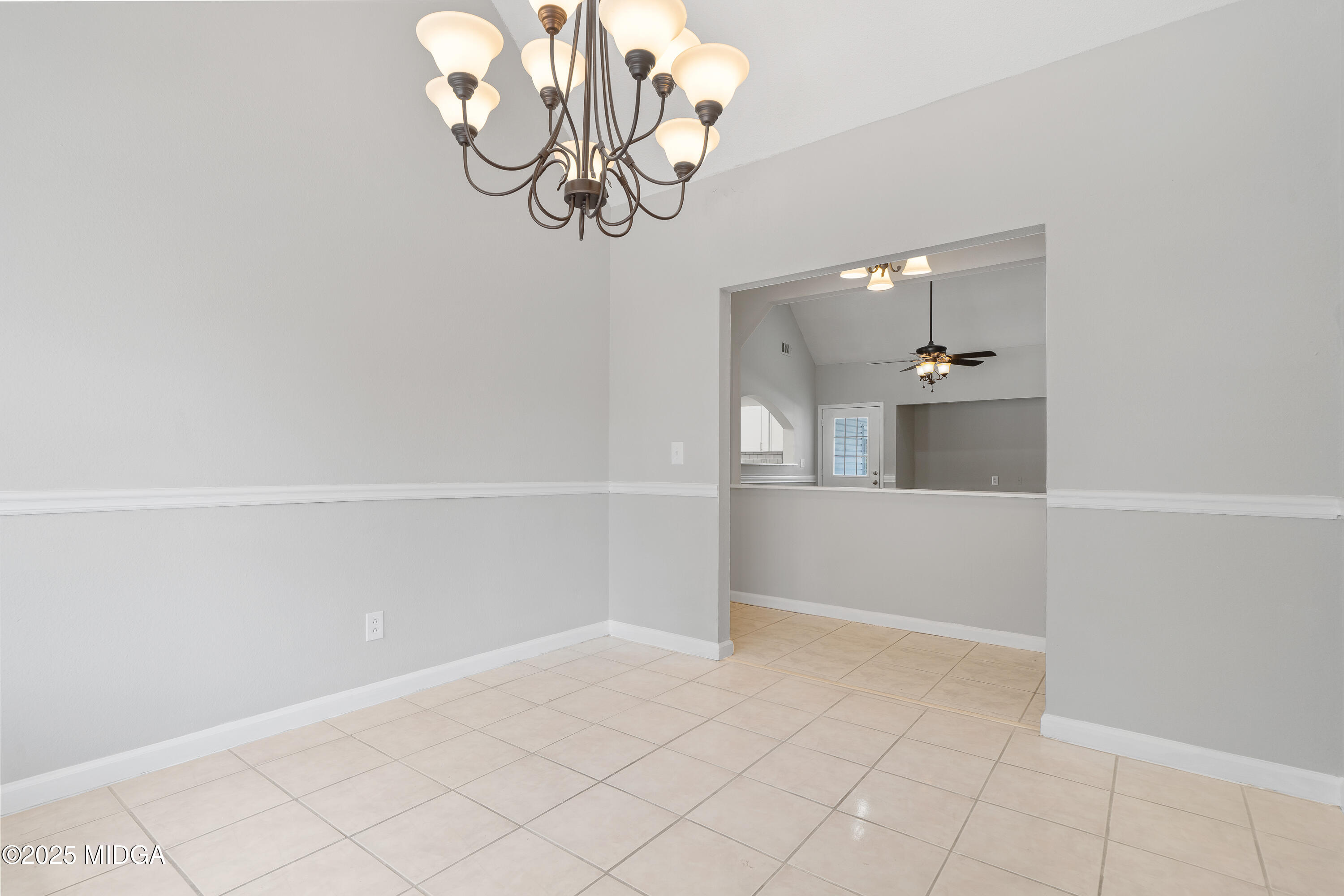 7513 Columbus Road Lizella, GA 31052 - Photo 14 of 56 a view of a room with wooden floor and chandelier