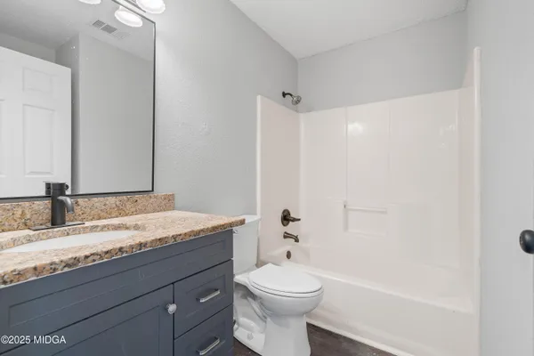 a view of an empty room and closet area