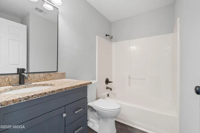 a view of an empty room and closet area