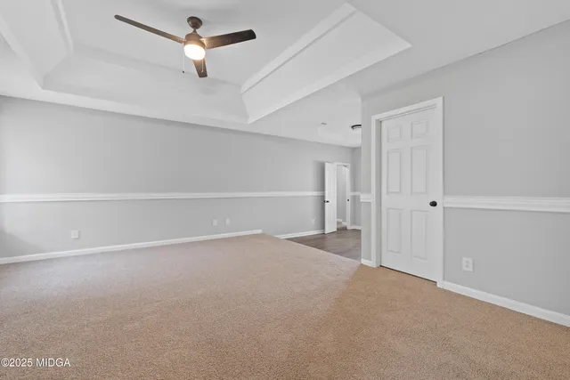 an empty room with a empty space and windows