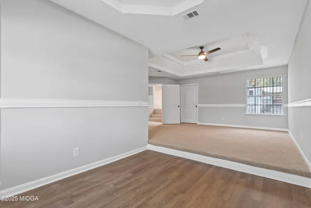 a en suite bathroom with a granite countertop tub and a sink