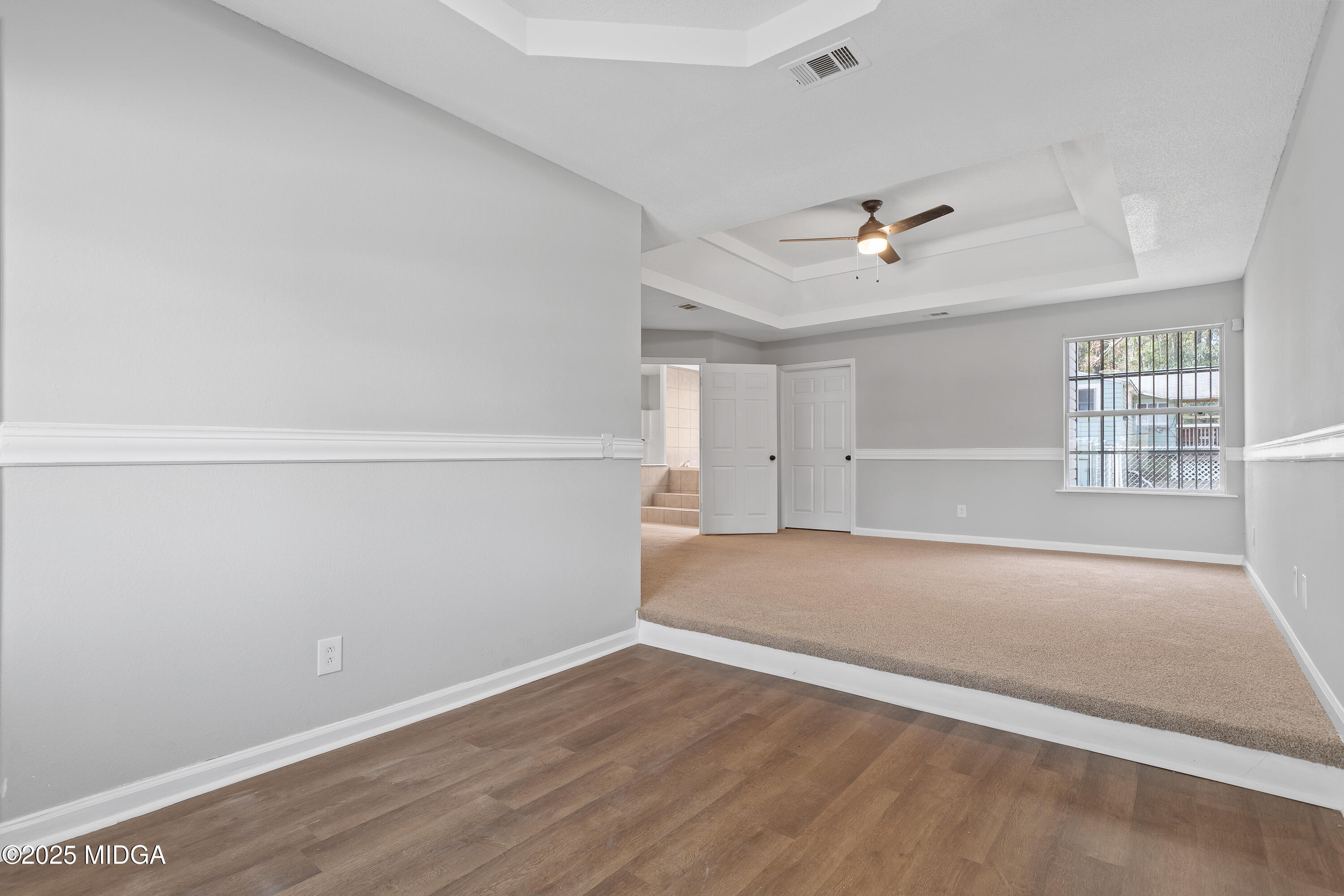 7513 Columbus Road Lizella, GA 31052 - Photo 30 of 56 an empty room with a empty space and windows