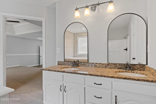 a view of hallway with wooden floor