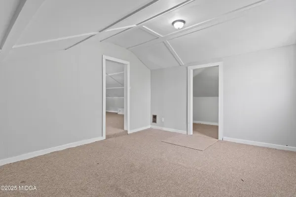 a view of an empty room and fire place