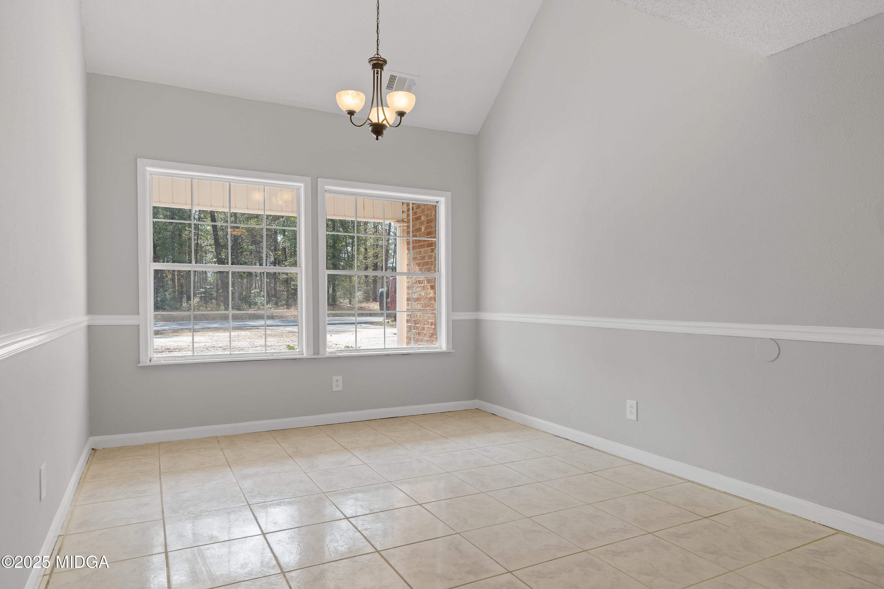 7513 Columbus Road Lizella, GA 31052 - Photo 5 of 56 en empty room with windows