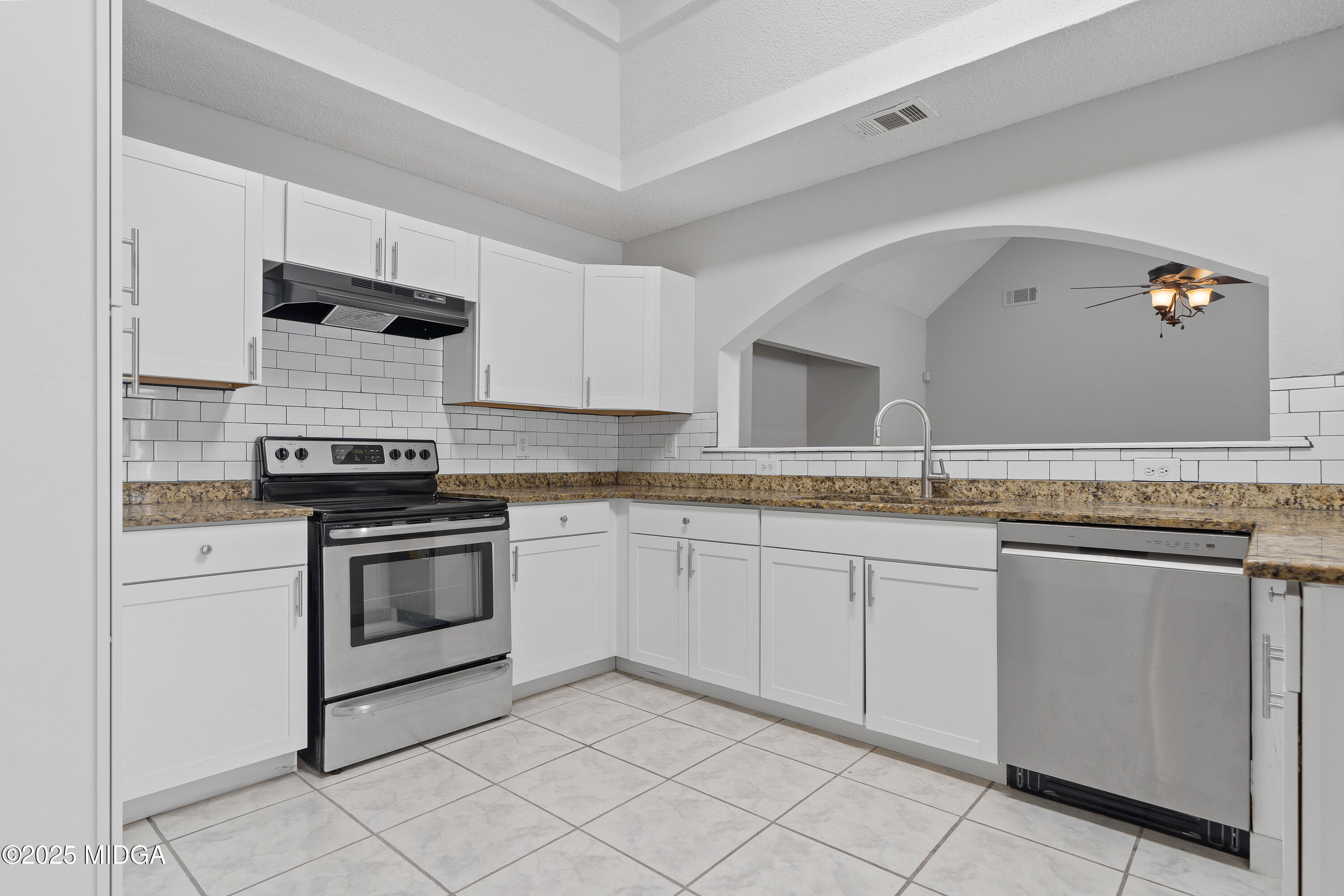 7513 Columbus Road Lizella, GA 31052 - Photo 8 of 56 a kitchen with granite countertop white cabinets and white appliances