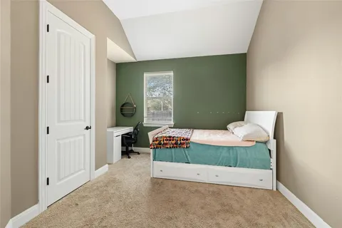 a room with a bed and a table in it