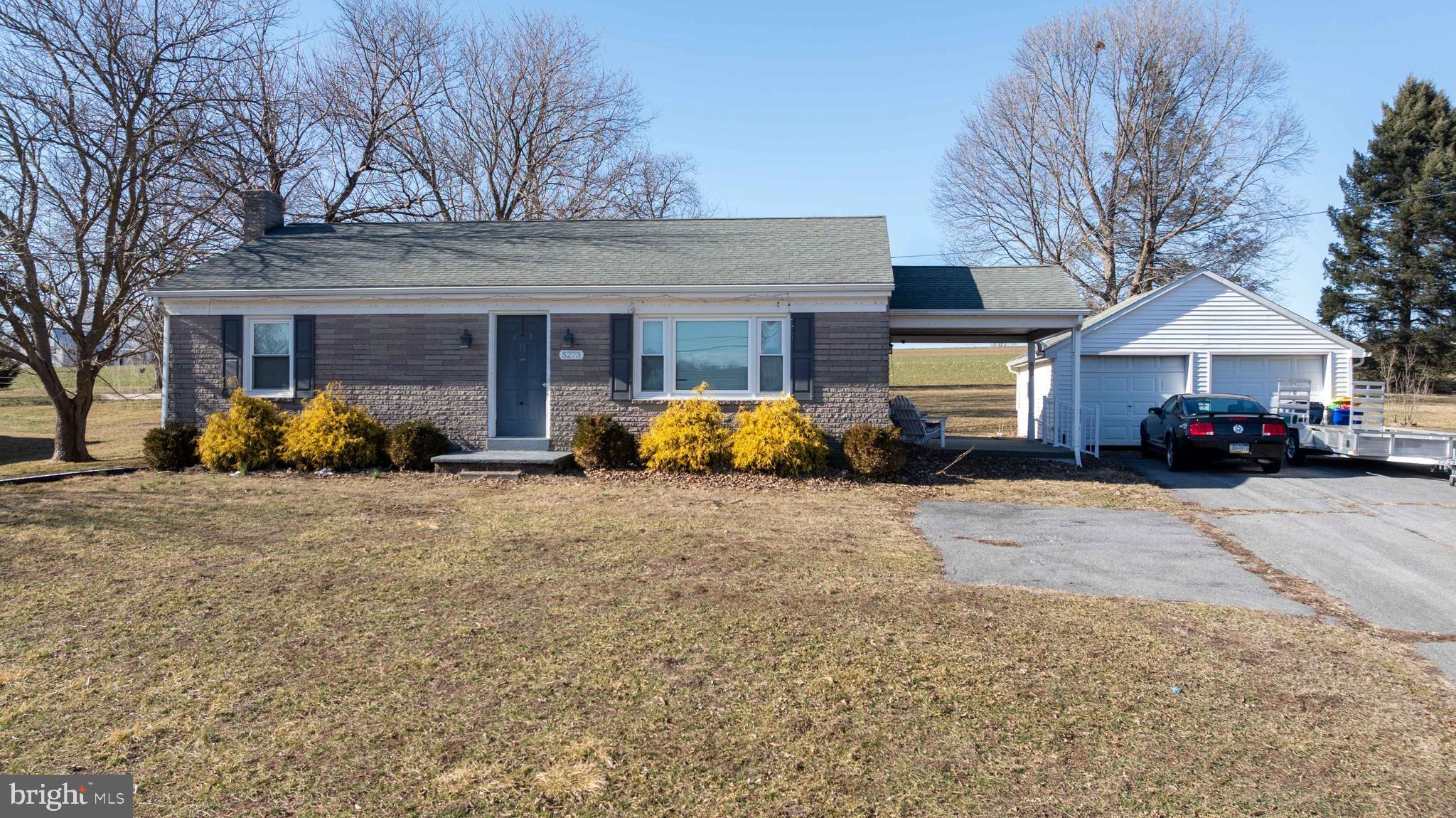 5273 Denlinger Road Gap, PA 17527 - Photo 38 of 54 a front view of a house with a yard and garage