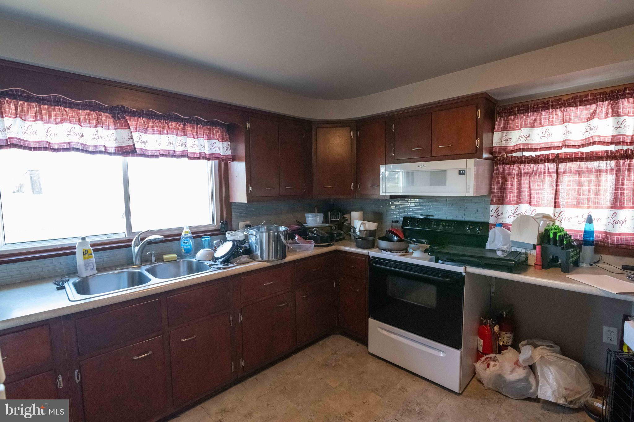 5273 Denlinger Road Gap, PA 17527 - Photo 9 of 54 a kitchen with a sink a window and cabinets