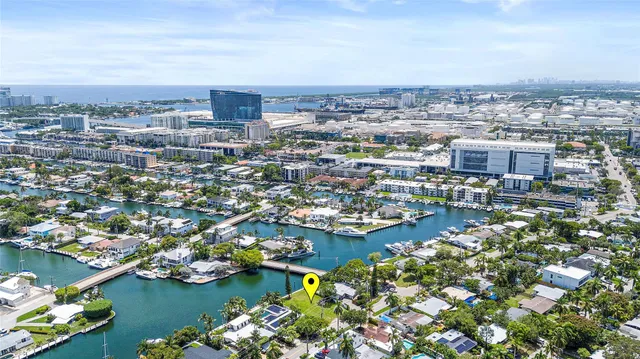 an aerial view of a city with ocean view