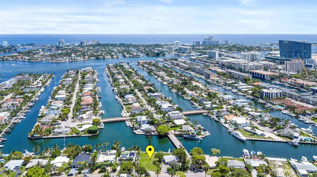 an aerial view of residential building and lake