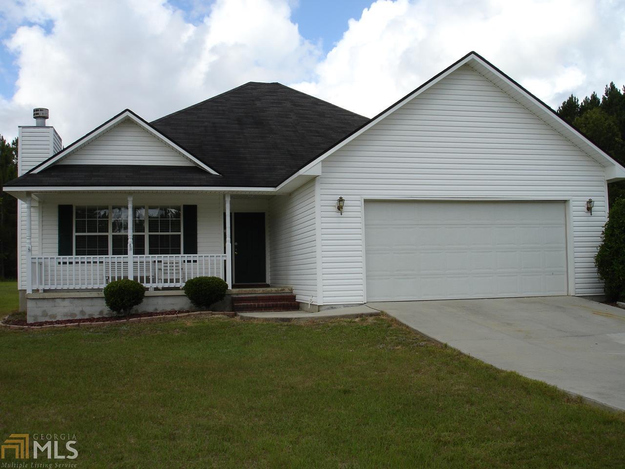 1608 Rebekah Road Statesboro, GA 30458 - Photo 1 of 1 a front view of a house with a garden