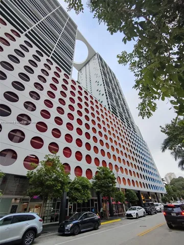 a view of street with parked cars