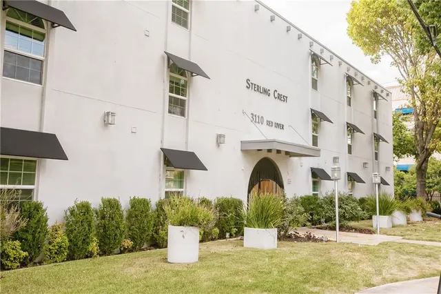 a front view of a building with garden