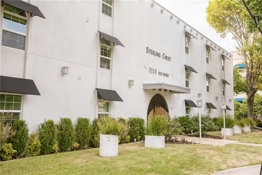 3110 Red River Street, Unit D315 Austin, TX 78705 - Photo 12 of 12 a front view of a building with garden