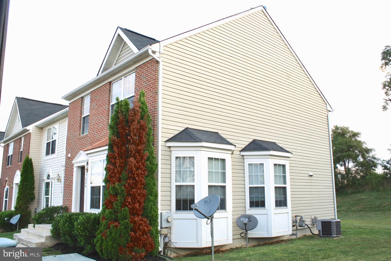 17626 Potter Bell Way Hagerstown, MD 21740 - Photo 20 of 21 a view of a white house next to a yard