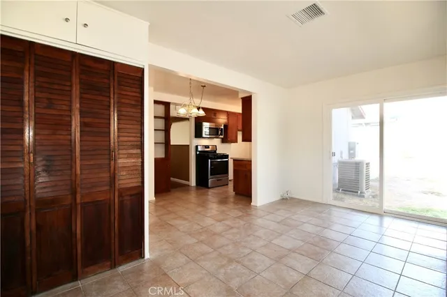 a view of kitchen with furniture and window
