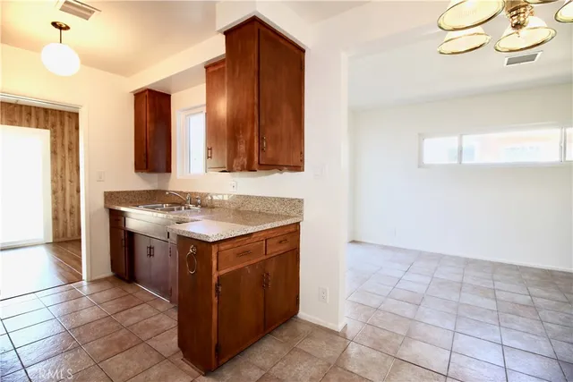 a kitchen with a stove and a sink