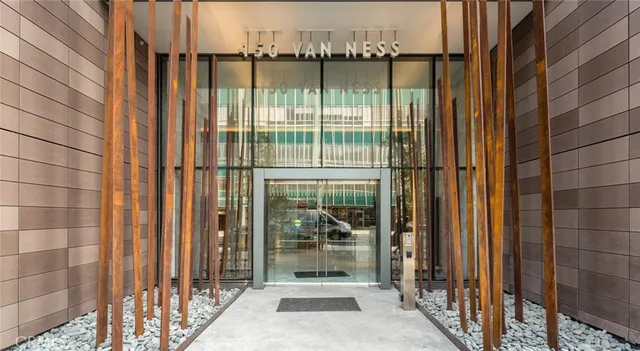 a living room with fireplace furniture and a large window