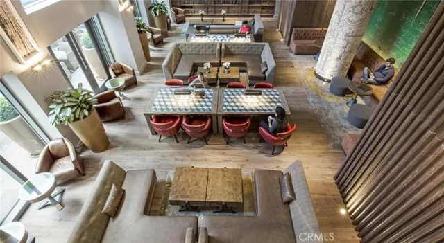 a view of a living room and kitchen with furniture