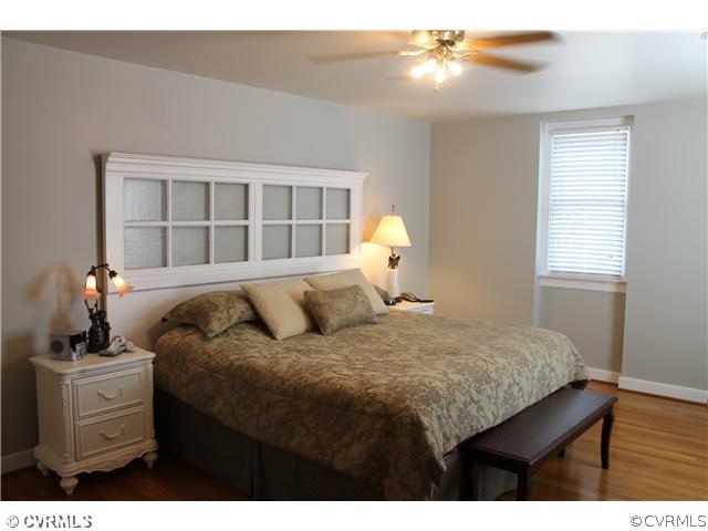 2700 Salisbury Road Midlothian, VA 23113 - Photo 14 of 17 a bedroom with a bed and a chandelier
