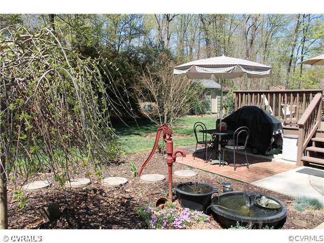 2700 Salisbury Road Midlothian, VA 23113 - Photo 4 of 17 a backyard of a house with table and chairs