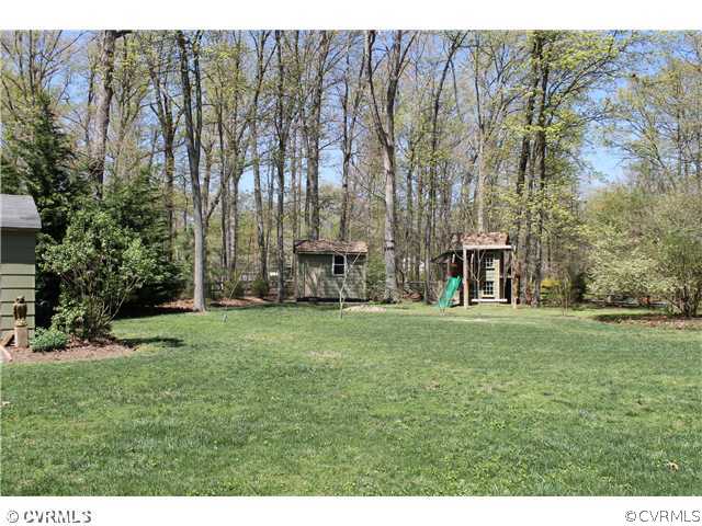 2700 Salisbury Road Midlothian, VA 23113 - Photo 5 of 17 a backyard of a house with table and chairs