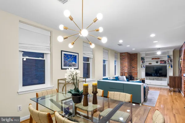 a living room with fireplace furniture and a flat screen tv