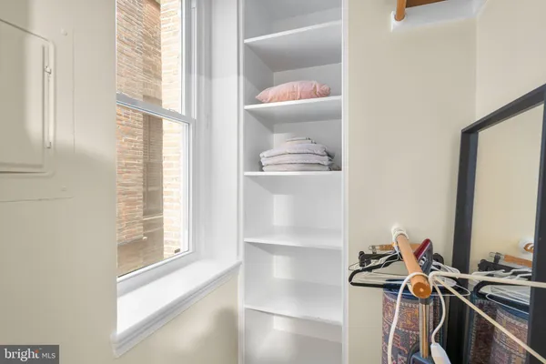 a view of a room with wooden floor