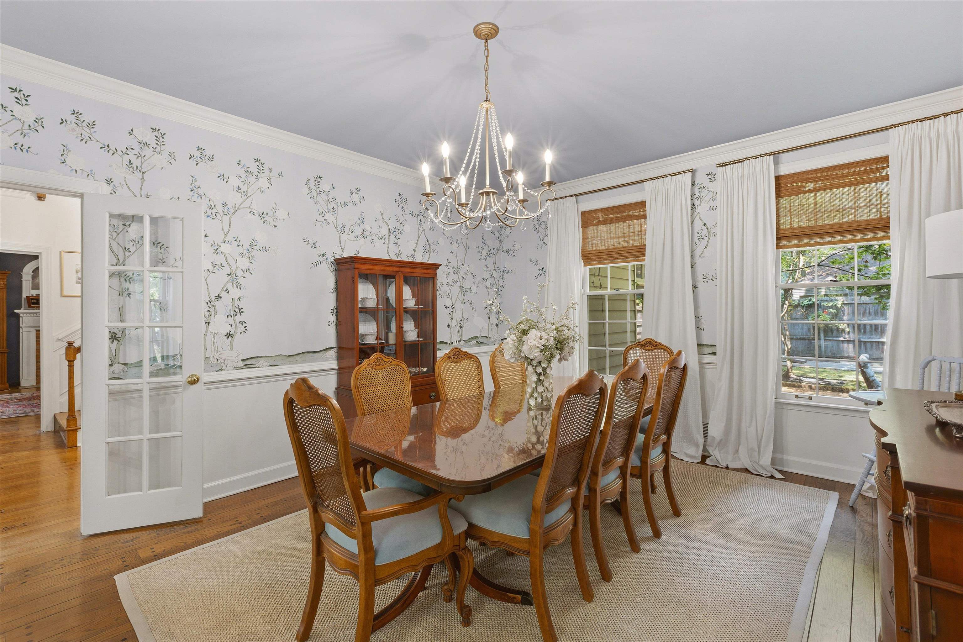 5828 Haymarket Road Memphis, TN 38120 - Photo 12 of 40 Dining area featuring decorative wall covering, crown molding, and a chandelier