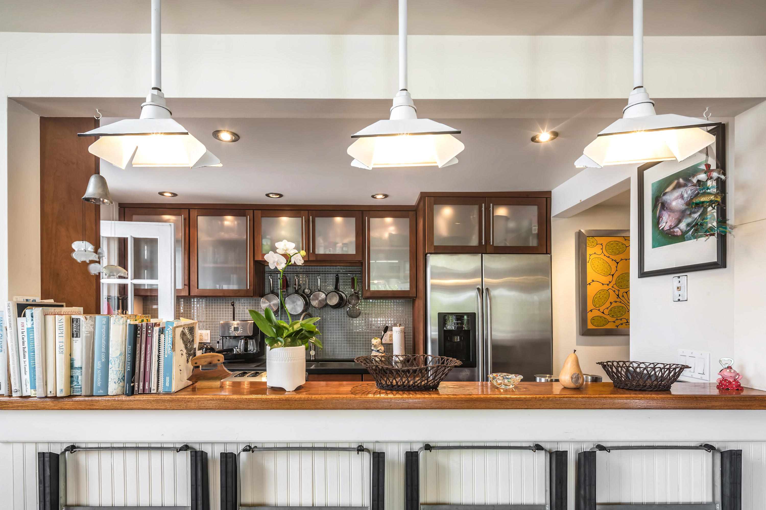 800 Fleming Street, Unit C2 Key West, FL 33040 - Photo 13 of 41 a dining table with chairs and chandelier