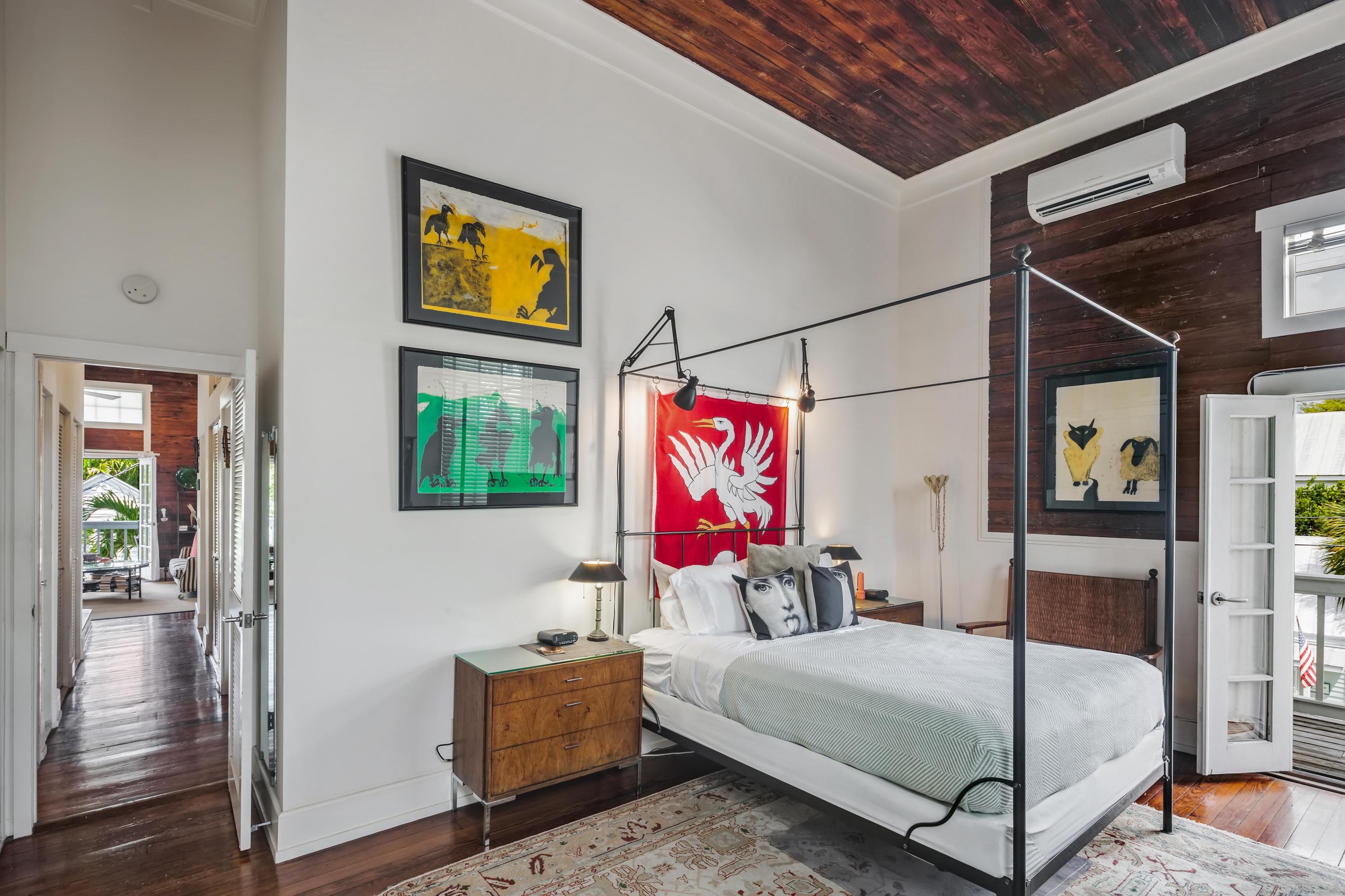 800 Fleming Street, Unit C2 Key West, FL 33040 - Photo 24 of 41 a bedroom with a bed and wooden floor