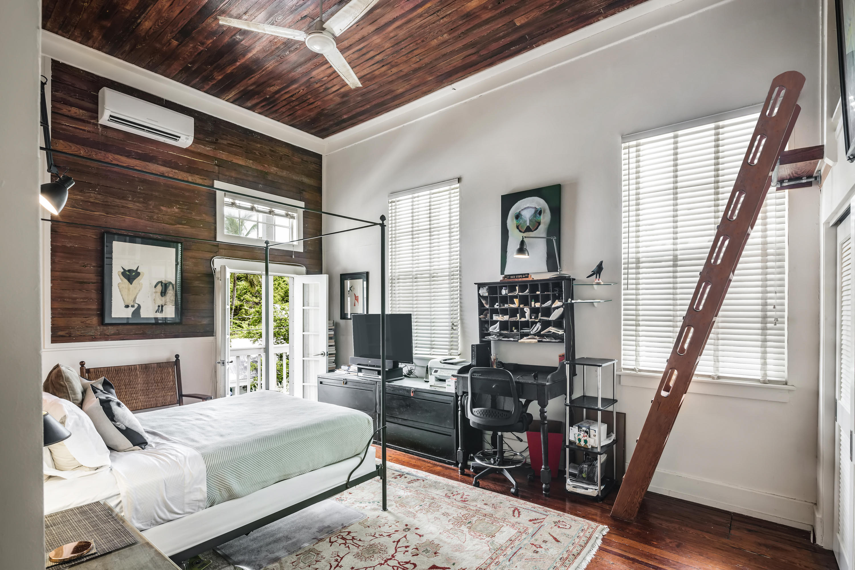 800 Fleming Street, Unit C2 Key West, FL 33040 - Photo 25 of 41 a bedroom with furniture and wooden floor
