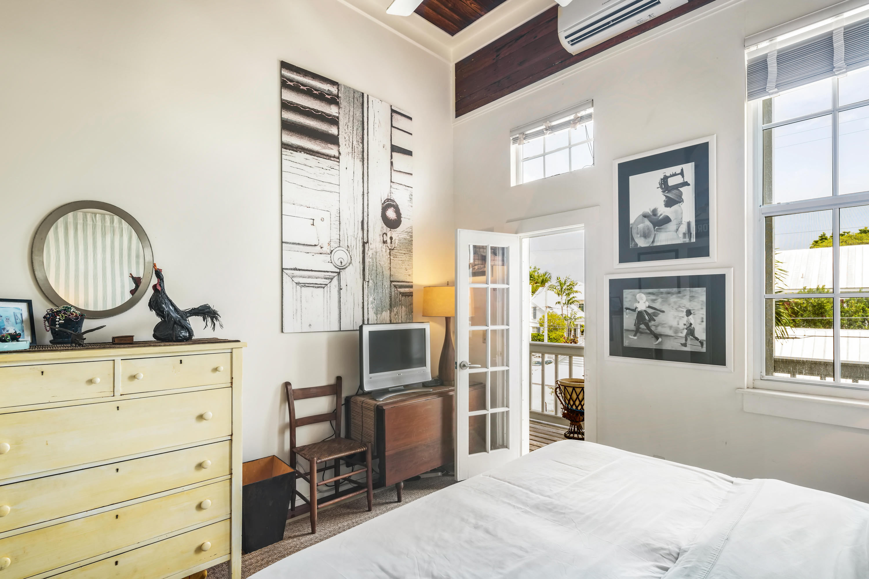 800 Fleming Street, Unit C2 Key West, FL 33040 - Photo 31 of 41 a bedroom with a bed and a dresser