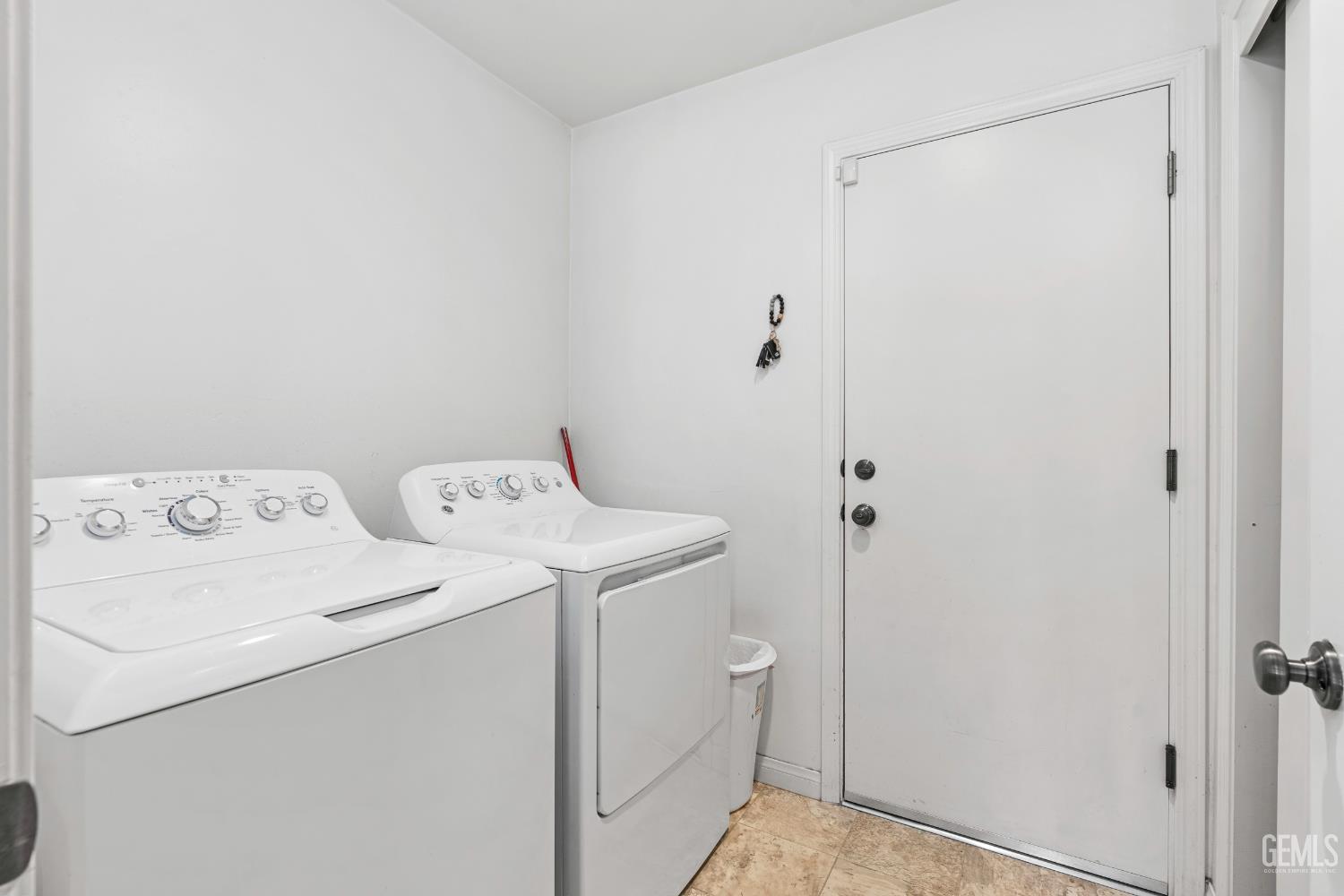 Undisclosed Address Bakersfield, CA 93306 - Photo 18 of 30 a utility room with dryer and washer