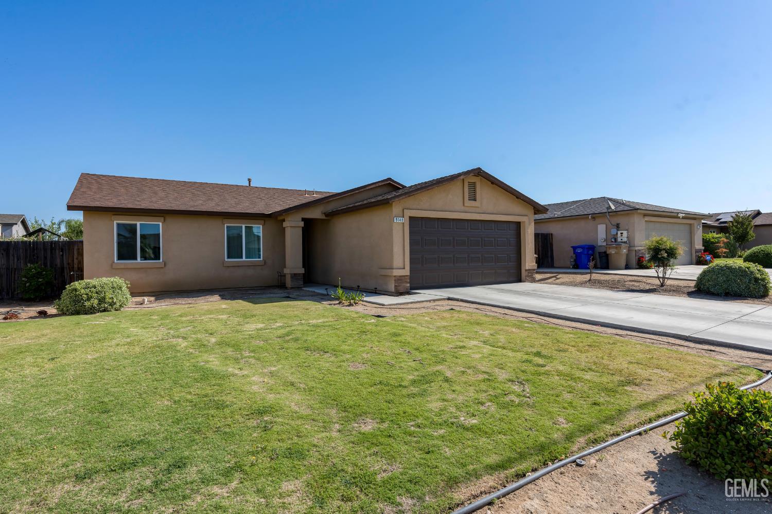 Undisclosed Address Bakersfield, CA 93306 - Photo 2 of 30 a front view of a house with a yard