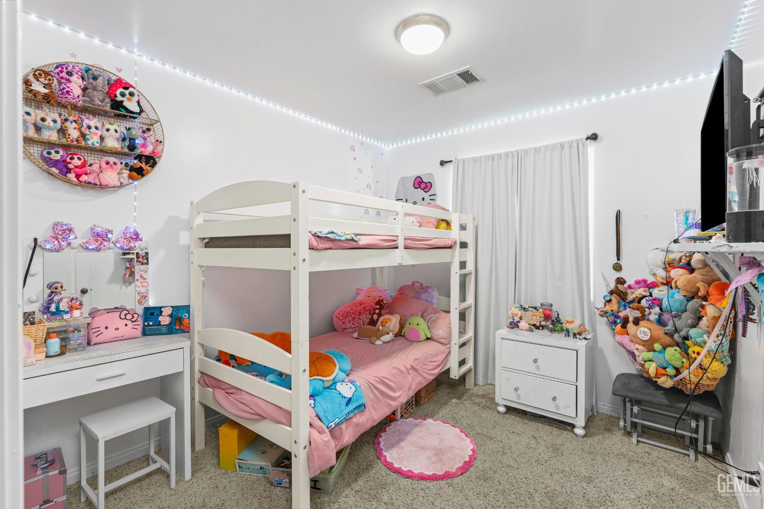 Undisclosed Address Bakersfield, CA 93306 - Photo 22 of 30 a bedroom with toys and a baby crib