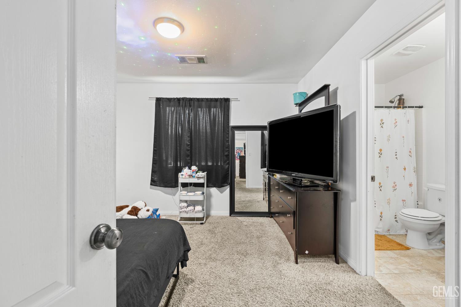 Undisclosed Address Bakersfield, CA 93306 - Photo 24 of 30 a living room with furniture and a flat screen tv