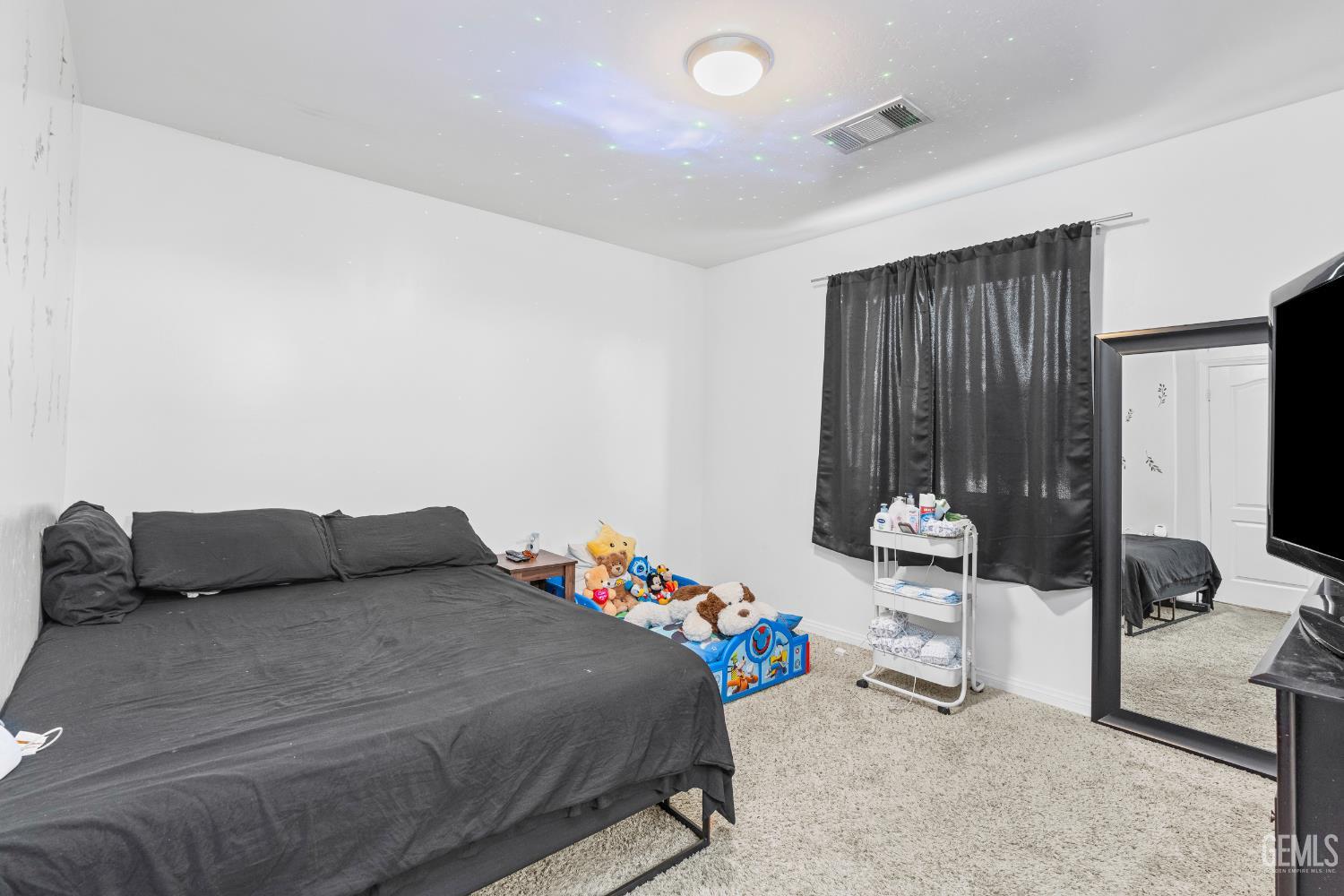 Undisclosed Address Bakersfield, CA 93306 - Photo 25 of 30 a bedroom with a bed and a couch