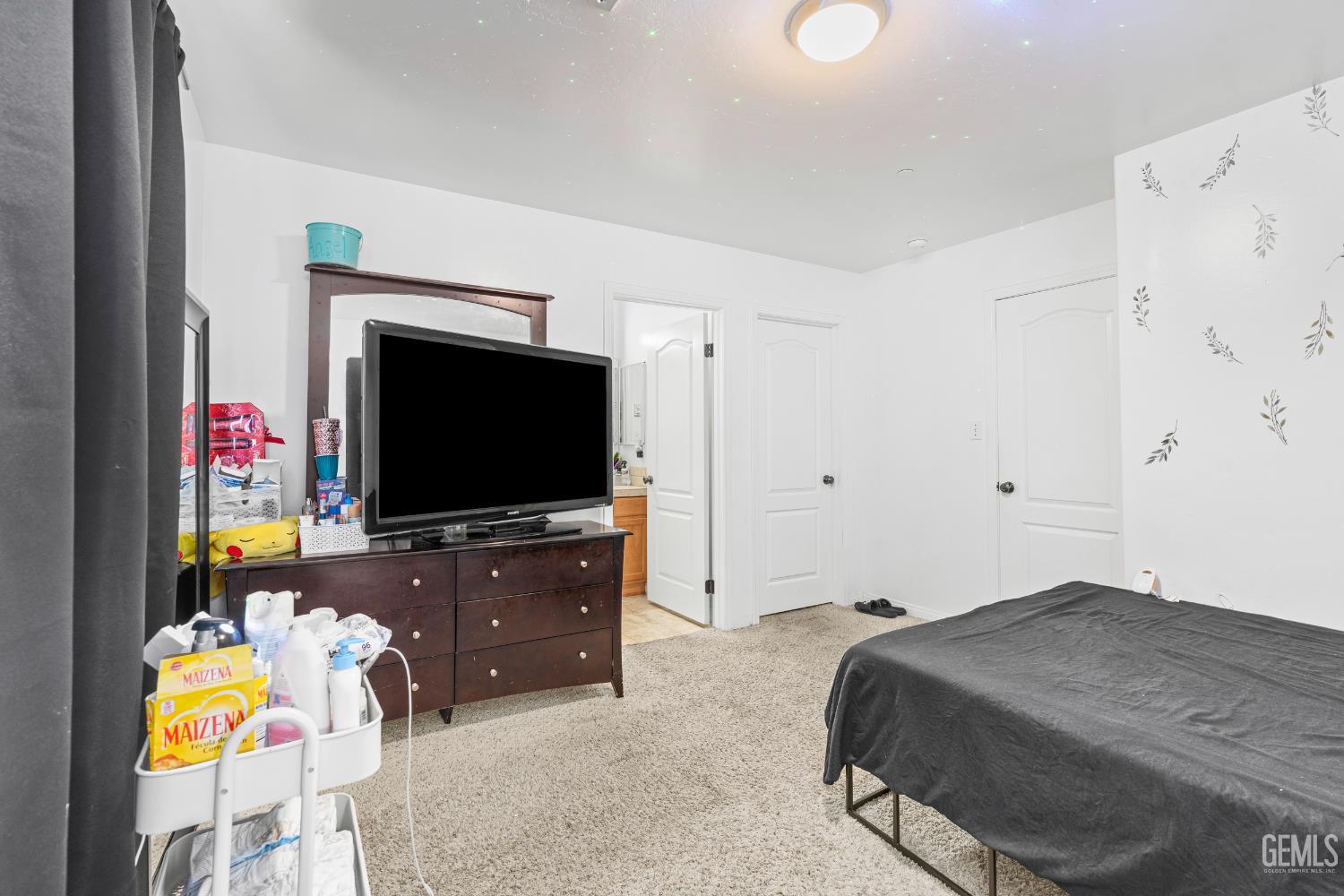 Undisclosed Address Bakersfield, CA 93306 - Photo 27 of 30 a bedroom with a bed and a flat screen tv