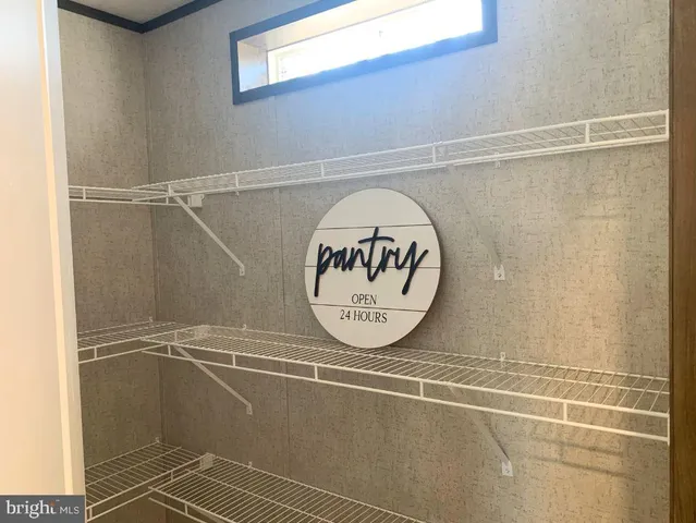 a kitchen with granite countertop a stove top oven microwave and cabinets