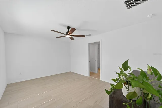 a view of a hallway with a potted plant