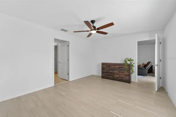 a view of workspace with furniture and a ceiling fan