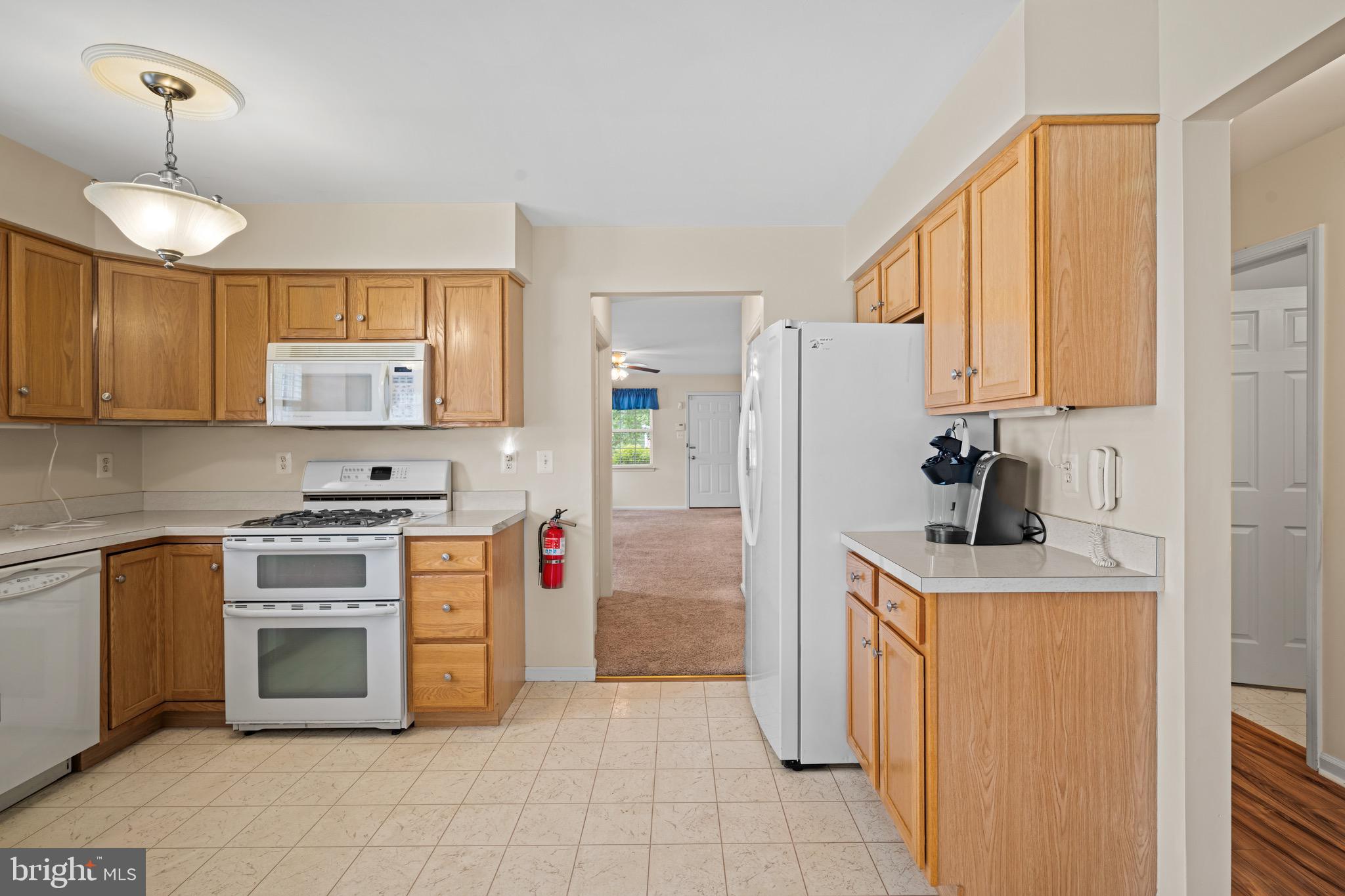 231 Gaunt Drive Mickleton, NJ 08056 - Photo 11 of 28 a kitchen with stainless steel appliances granite countertop a stove a refrigerator and a stove